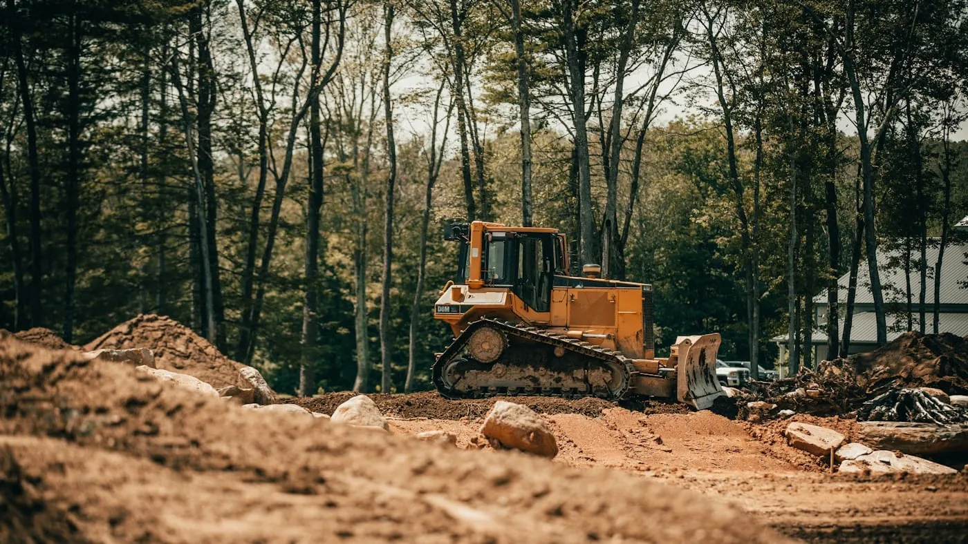 Yellow dozer working on cleared ground