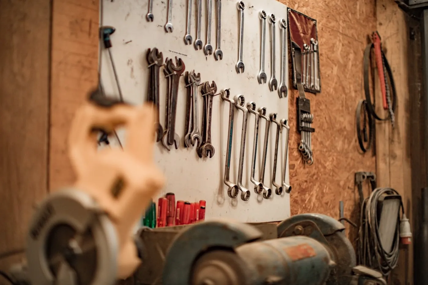 Hand tools hanging on a workshop wall